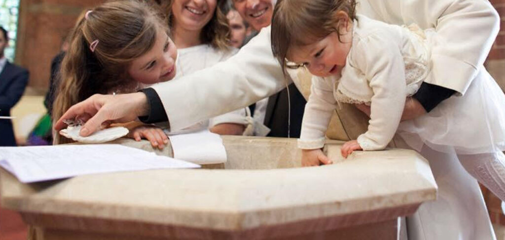 toddler being baptised at Saint Georges Church Barbourne
